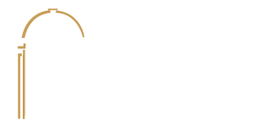 Logo of Wells construction featuring the word "Wells" in bold, uppercase letters with a stylized "i" above the word "construction" in a smaller font, all within a golden arch.